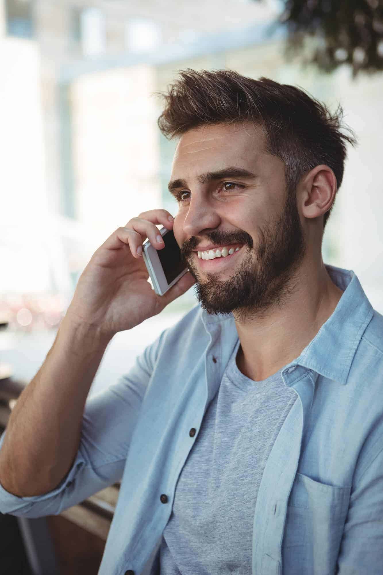 executive-talking-on-mobile-phone-in-park.jpg